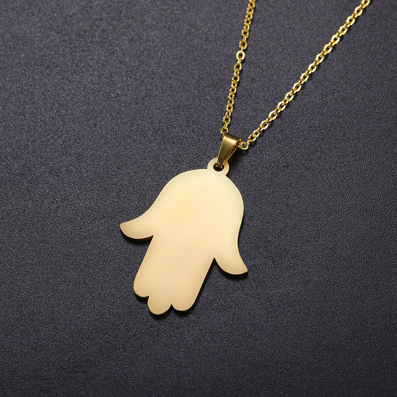 Close-up of Hamsa Hand charm pendant necklace