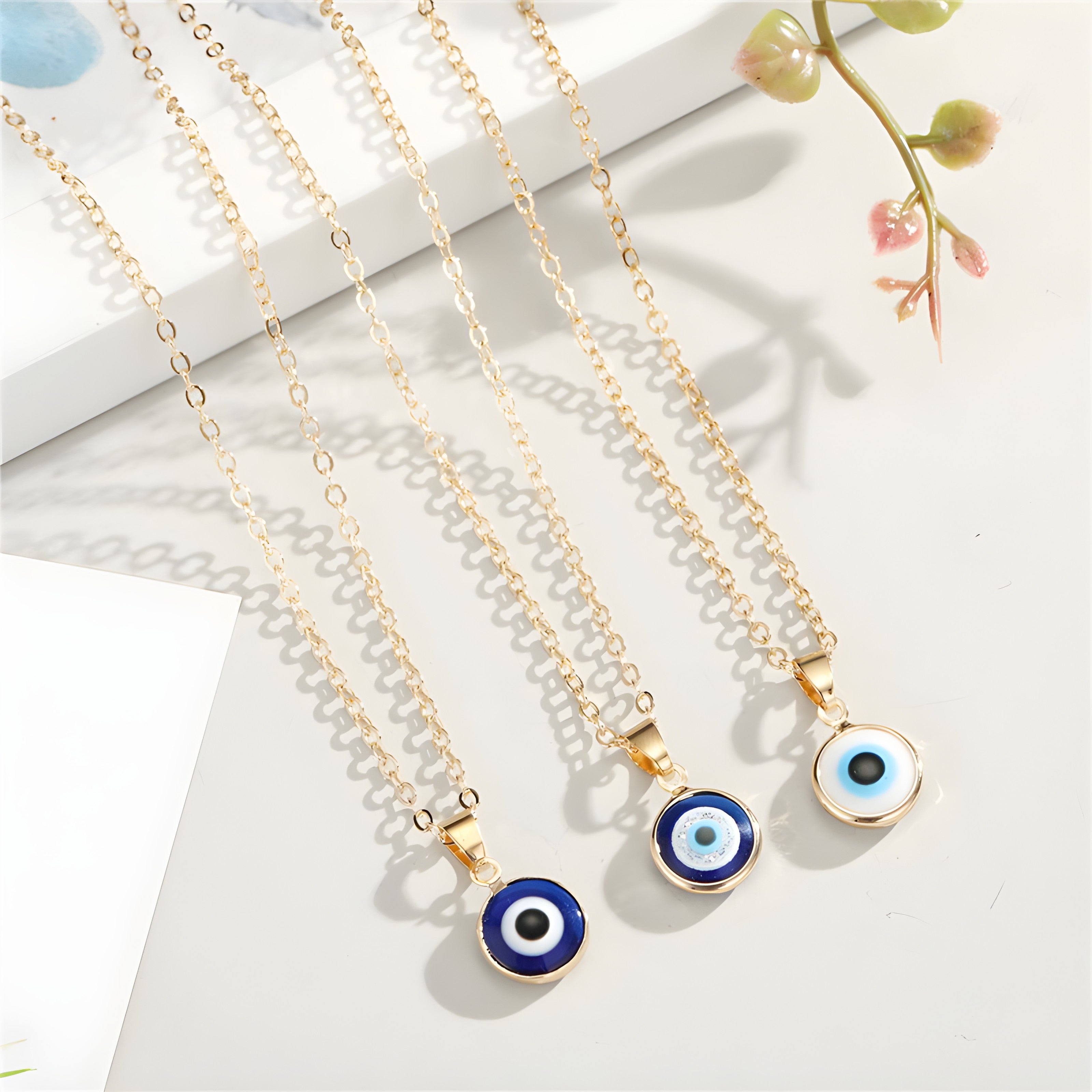 Handmade evil eye charm necklace featuring blue pendant on delicate chain