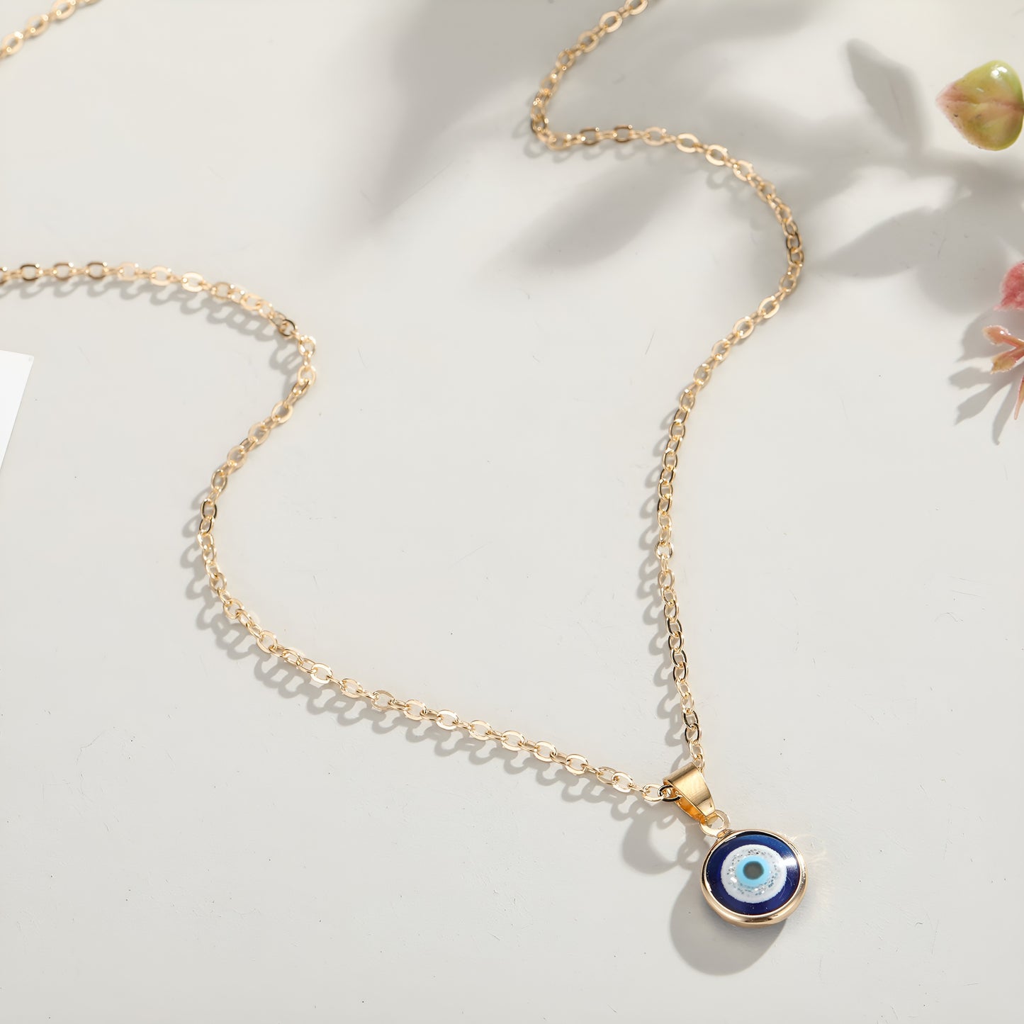 Protective blue evil eye pendant on silver chain for everyday wear