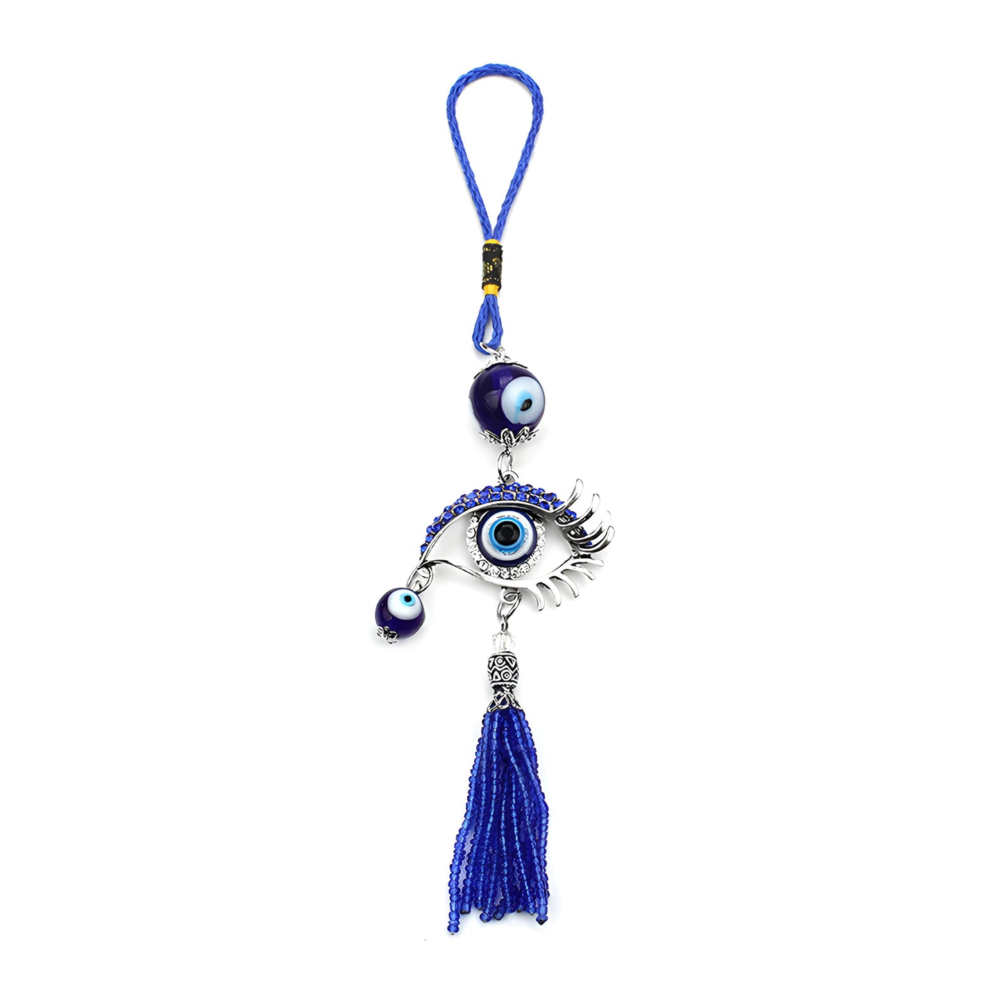 Handmade evil eye ornament hanging from car rearview mirror