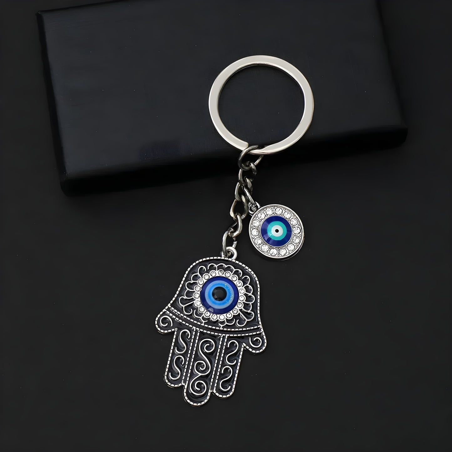 Stylish hamsa and evil eye keyring symbolizing defense against negativity
