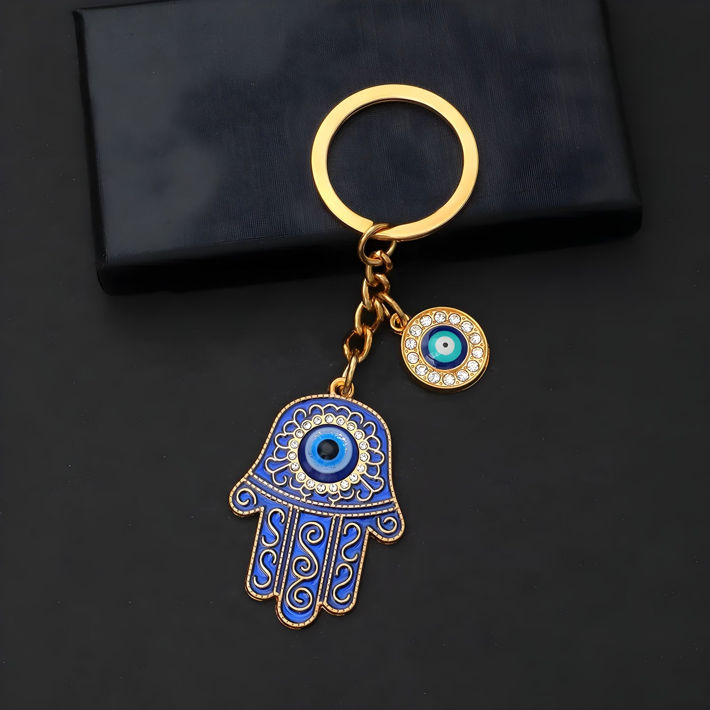 Spiritual keychain with hamsa hand and blue evil eye for positive energy