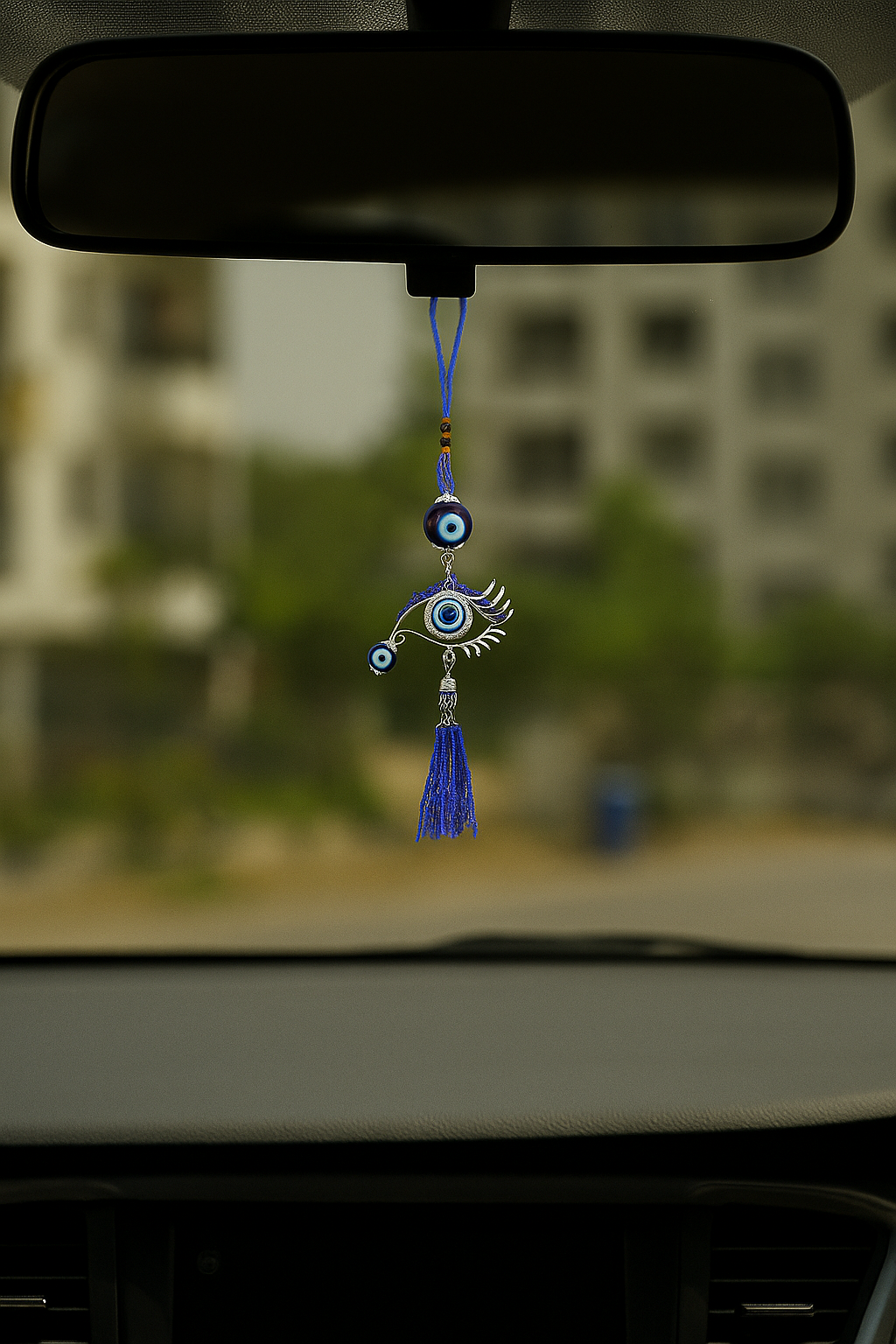 Blue evil eye car hanging charm for protection on the road