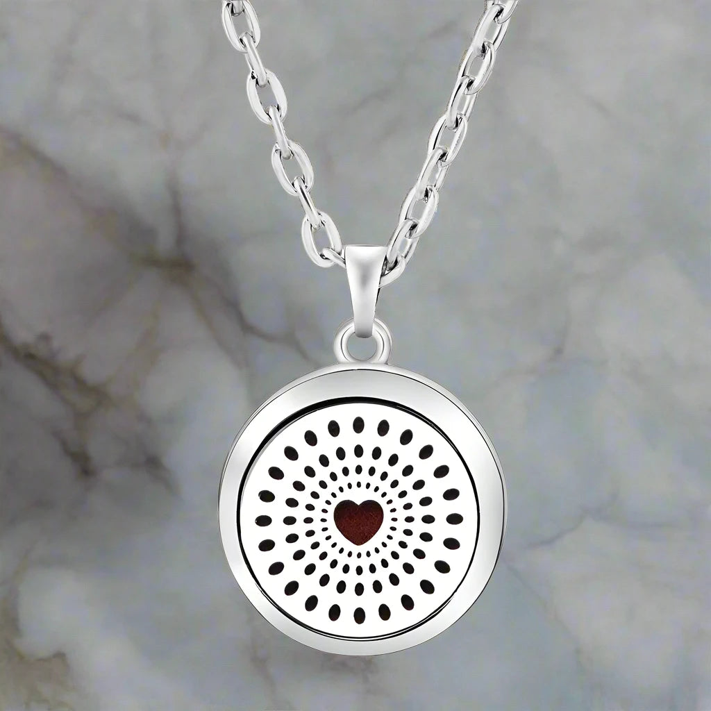 Refillable essential oil diffuser locket on sleek chain for fragrance on-the-go
