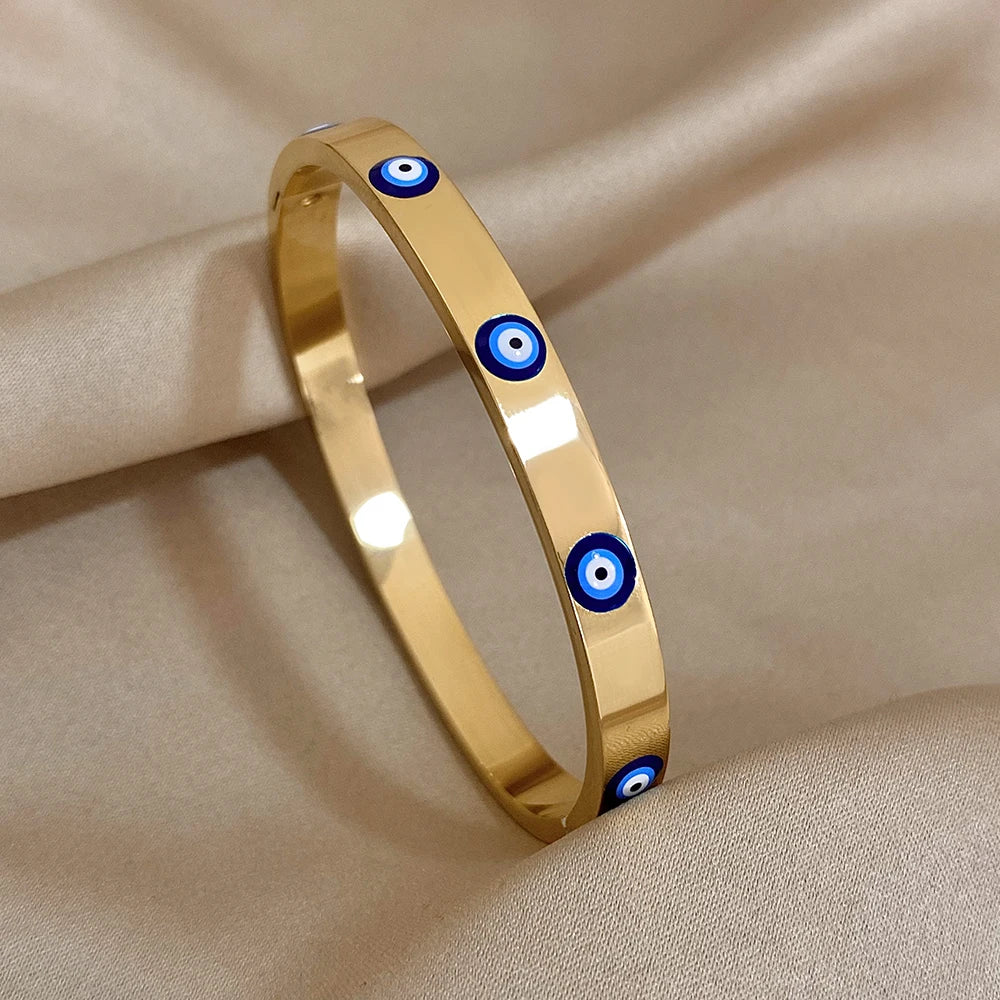 Stylish gold evil eye cuff bracelet to ward off negative energy and bad luck