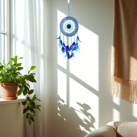 Handmade blue dream catcher with feathers and beads for spiritual protection

