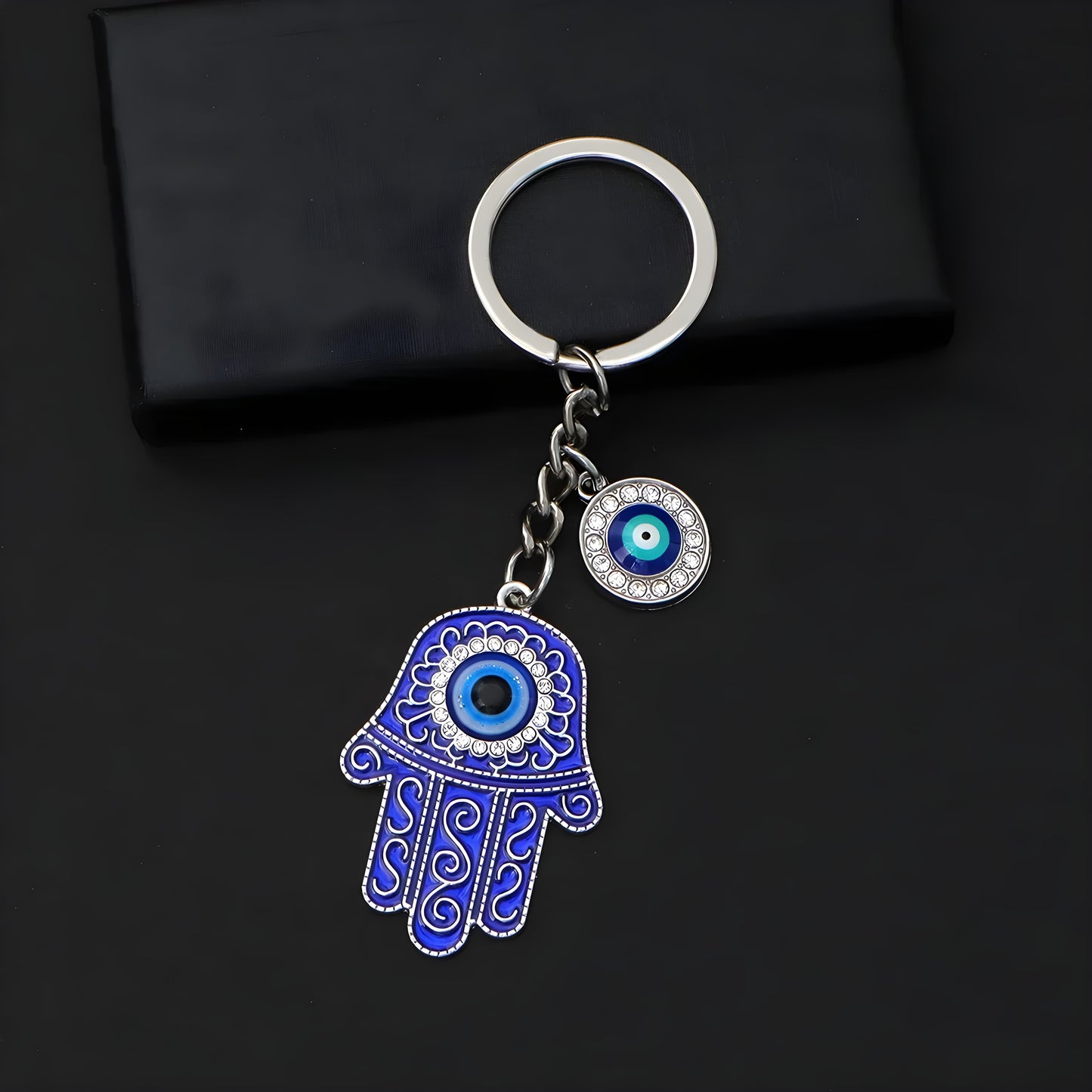 Handmade protective keychain featuring hamsa hand and evil eye charms

