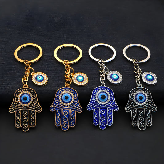 Handmade protective keychain featuring hamsa hand and evil eye charms


