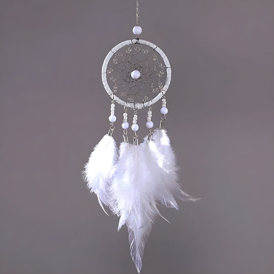 Handmade dream catcher charm hanging from car rearview mirror