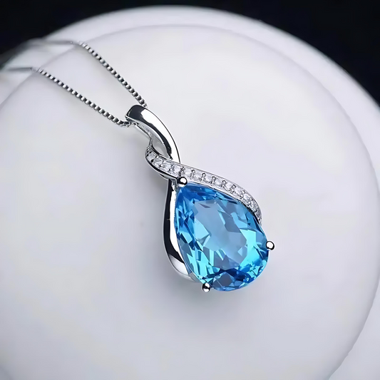 Blue teardrop pendant on a white background